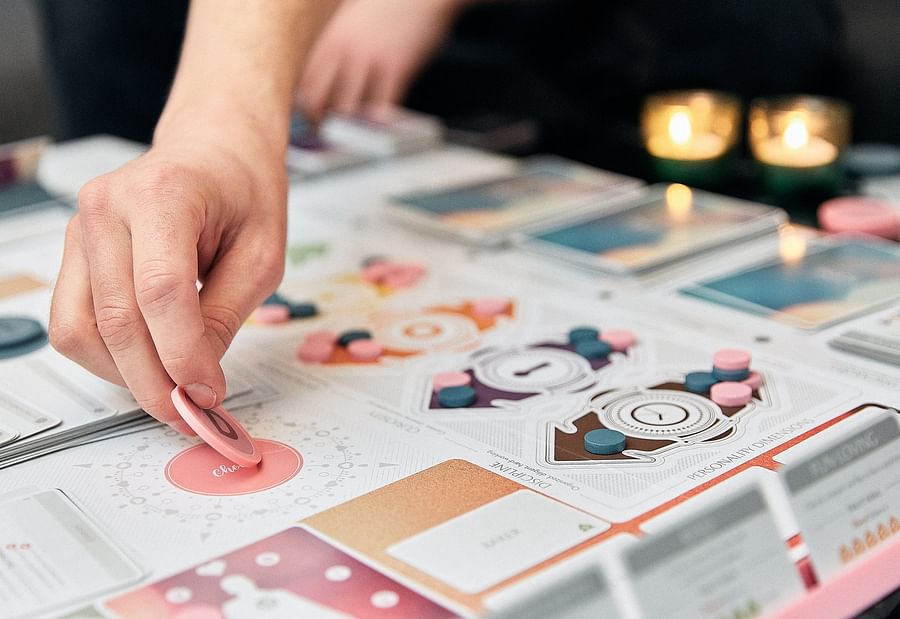 Fog of Love board game and its components spread out on a table